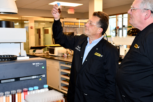 Yancey Fluid Analysis Technicians Evaluating Fluid Test