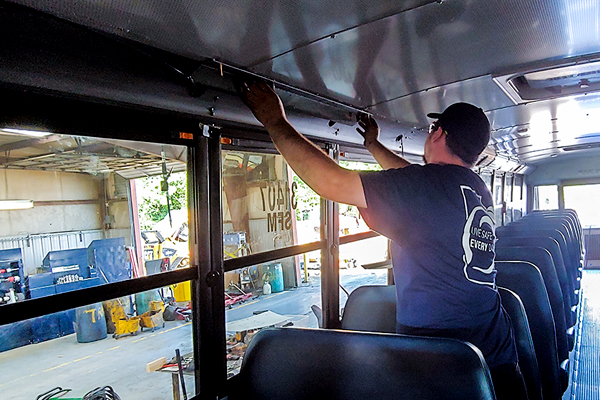 Yancey Bus Technician Working Inside Bus
