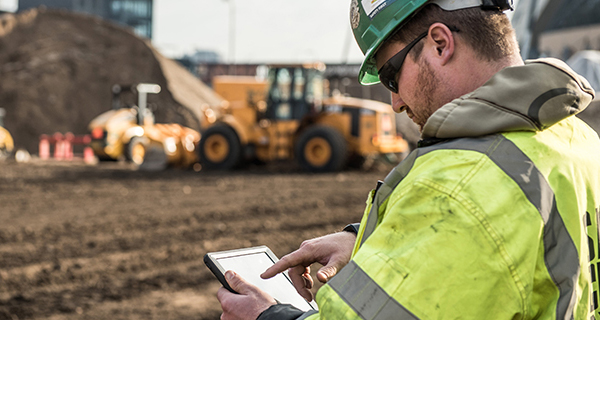 Construction Worker Working on Tablet